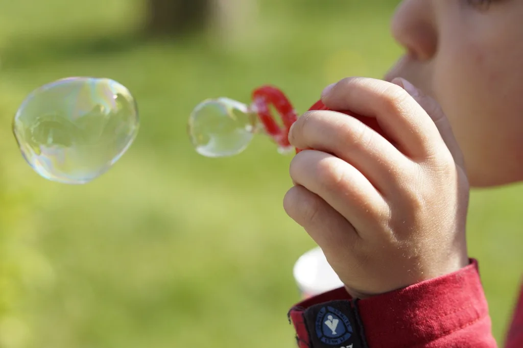 Child blowing bubbles